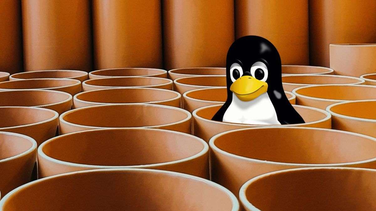 Tux the penguin pops out of a pipe